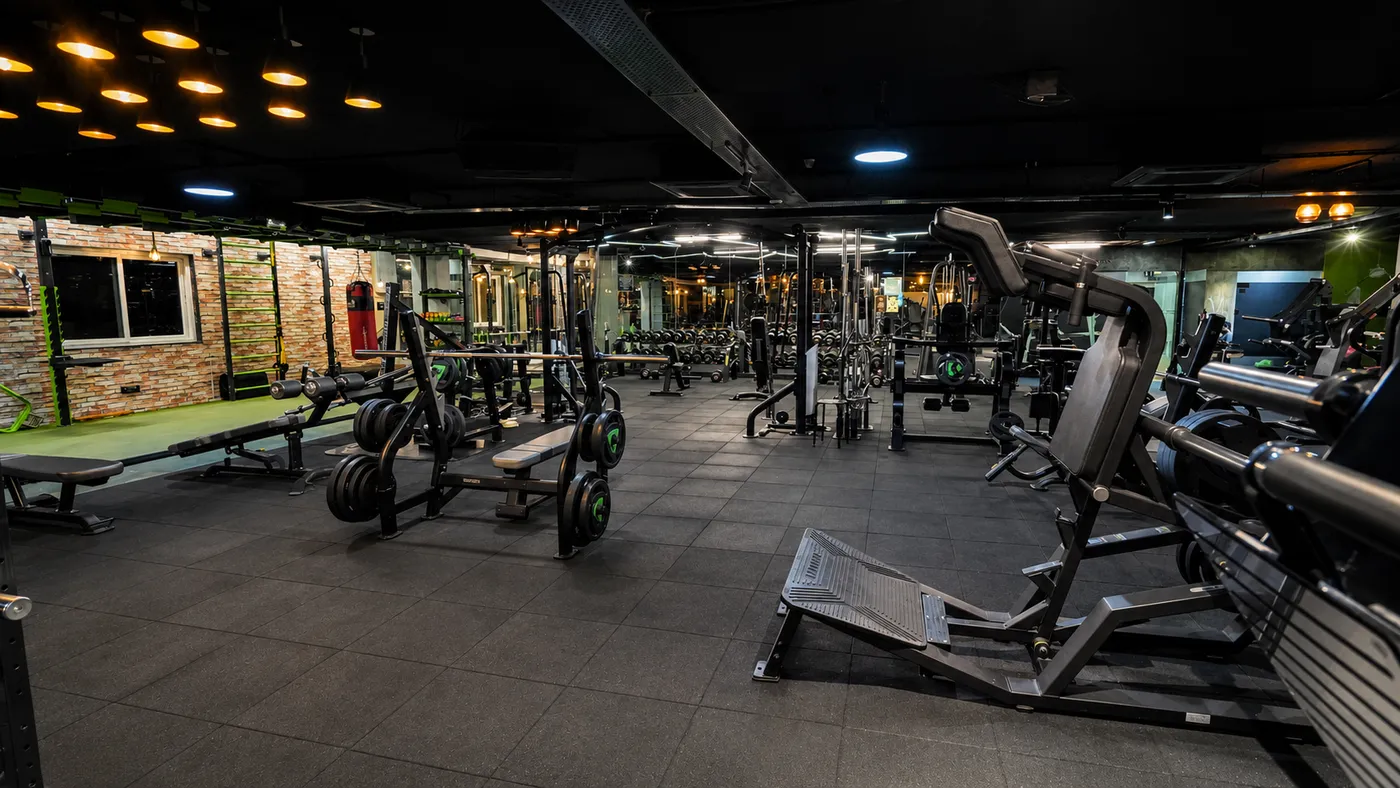 The main equipment floor with strength machines and benches at V2 Fitness Zone Sainikpuri